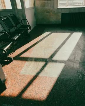 Shadow from a window on a tiled floor. Abstract background Stock Photos