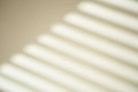 The shadow from the window on a white wall in sunny weather with bright light Stock Photos