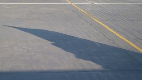 Shadow of wing - aircraft taxiing to runway for takeoff Stock Footage 95567853