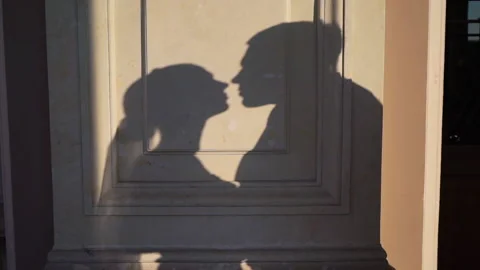 vintage couple kissing shadow