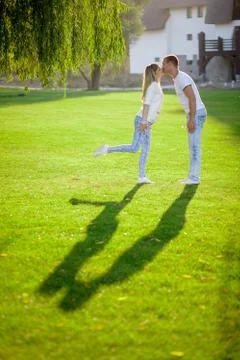 The shadow of a young couple on the grass Stock Photos