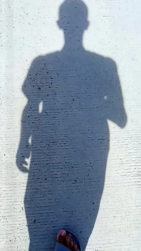 The shadow of a young man Stock Footage 321765636