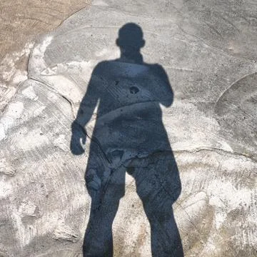 Shadow of a young man Stock Photos