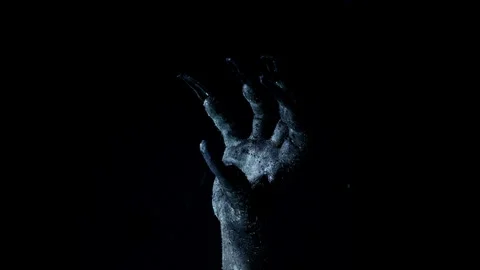 Shadow of a zombie hand on black background Stock Footage 318048354