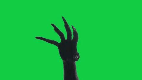Shadow of a zombie hand on green screen background. Stock Footage 317818747