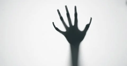 Shadow of a zombie hand on white background Stock Footage 241467760