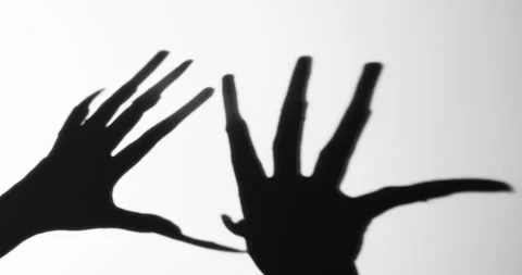 Shadow of a zombie hand on white background Stock Footage 277205546