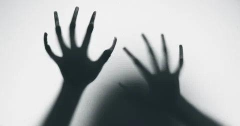 Shadow of a zombie hand on white background Stock Footage 278086422