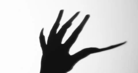 Shadow of a zombie hand on white background Stock Footage 278089975