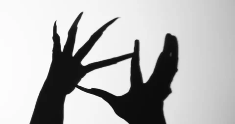 Shadow of a zombie hand on white background Stock Footage 293560910