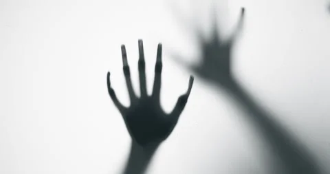 Shadow of a zombie hand on white background Stock Footage 303326522