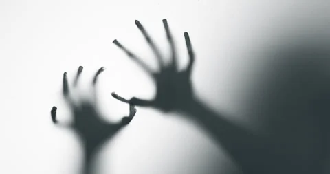 Shadow of a zombie hand on white background Stock Footage 303452464