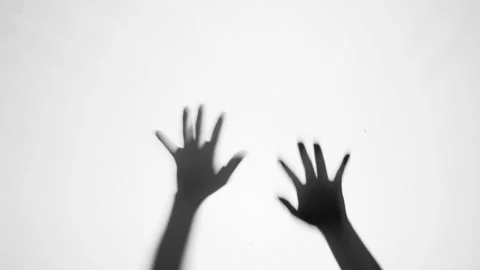 Shadow of a zombie hand on white background Stock Footage 317767773