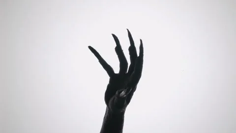 Shadow of a zombie hand on white background Stock Footage 317821423