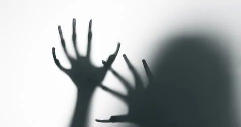 Shadow of a zombie hand on white background Stock Footage 317882051