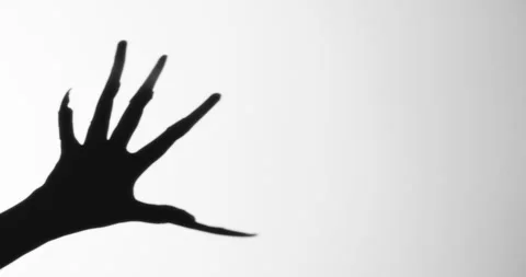 Shadow of a zombie hand on white background Stock Footage 324318292