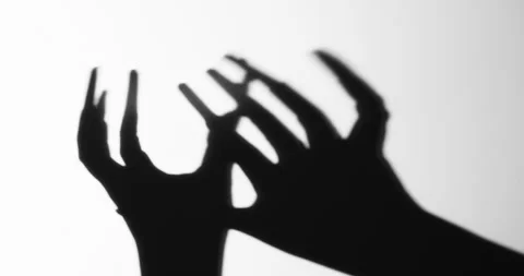 Shadow of a zombie hand on white background Stock Footage 336646643