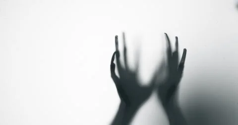 Shadow of a zombie hand on white background Stock Footage 338270763