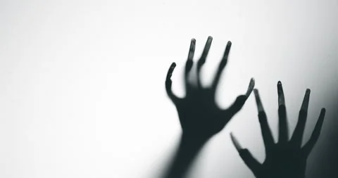 Shadow of a zombie hand on white background Stock Footage 338270837