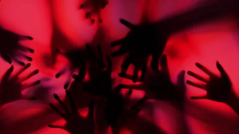 Shadow of a zombie's hand in red scene., Slow motion Stock Footage 196993548