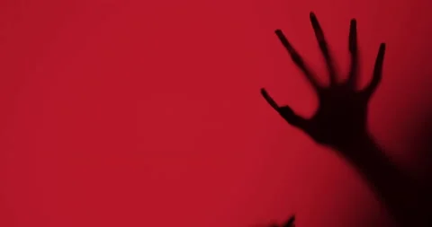 Shadow of a zombie's hand in red scene. Stock Footage 208222640