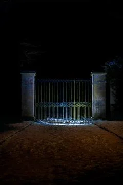 Shadowed Iron Gate Under Winter Night Sky Stock Photos
