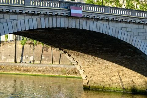 Shadowed stone arch of Louis-Philippe Bridge Stock Photos