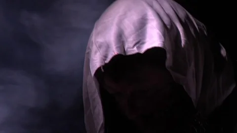 Shadowly caped figure emerging in mist during halloween Stockbeeldmateriaal 81545870