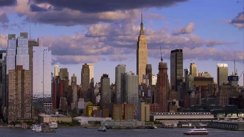 Shadows and sunlight cast over New York City buildings along the Hudson River. Stock Footage 78798603