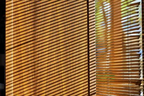 Shadows from the blinds on the window slope Stock Photos