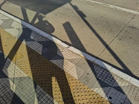 Shadows at a bus stop. Stock Photos
