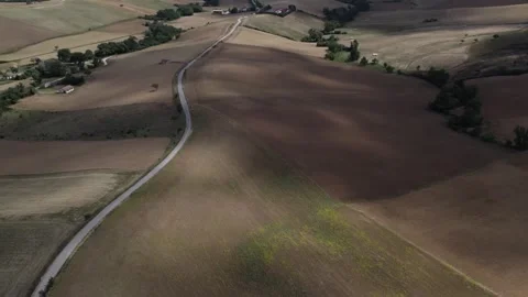 Shadows of clouds on the hay rolls in farm fields in autumn cloudy day Stock Footage 311702516