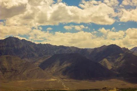Shadows of clouds in a mountain valley Foto stock