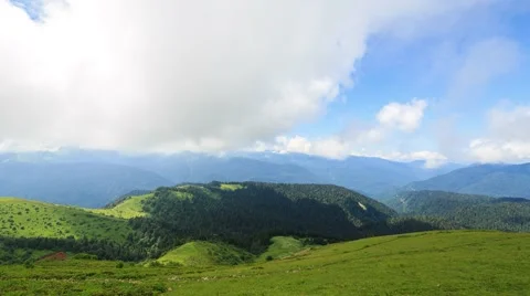 The shadows of the clouds in the mountains. Zoom. Time Lapse. Sochi, Russia. Vídeo Stock 53747055