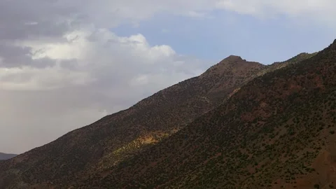 Shadows of clouds pass over the mountains, timelapse. Stock Footage 247184663