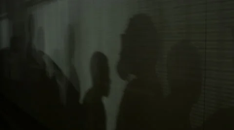 Shadows of a Crowd of People on a Wall 4K Stock Footage 43144524