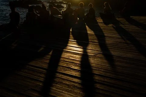 Shadows on the deck at dusk Stock Photos