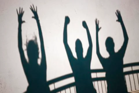Shadows of ecstatic people Stock Photos