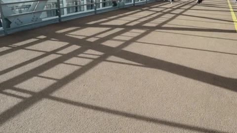 Shadows in the elevated passage corridor bridge sun beams geometric lines Stock-Footage 165417729