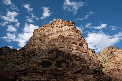 Shadows fall on rocky mountain cliff in Nine Mile Canyon Stock Photos