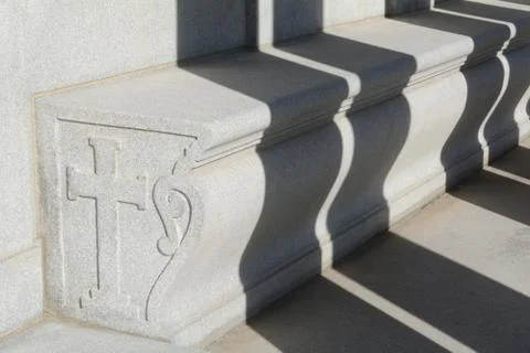 Shadows falling over cemetery bench Stock Photos