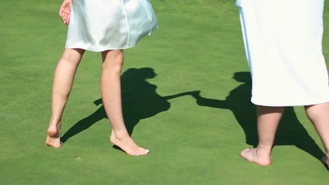 Shadows on the grass from a young couple. Stock Footage 81812450