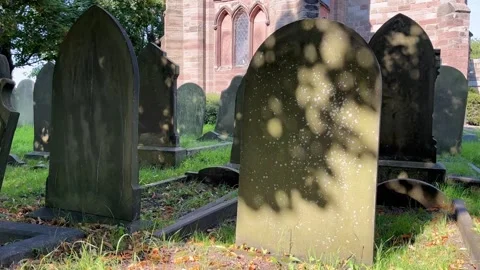 Shadows on a gravestone in a churchyard Stock-Footage 280965836
