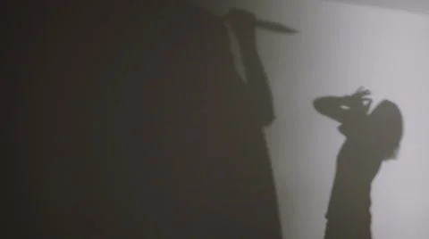 Shadows of a killer with a knife and his victim Stock Footage 59376667