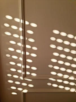 Shadows of light on the wall Stock Photos