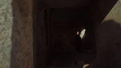 Shadows linger in ancient stone walls of a forgotten place Stock Footage 296190613