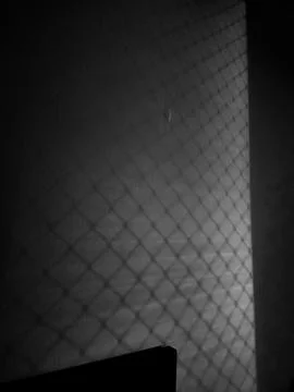 Shadows of Mesh on the Wall Stock Photos