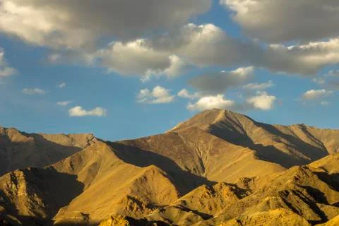 Shadows on the mountains under the clouds Stock Photos