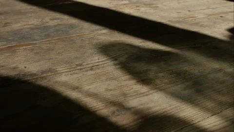 Shadows move along the surface old wooden floor. Time-lapse. Stock Footage 154705254