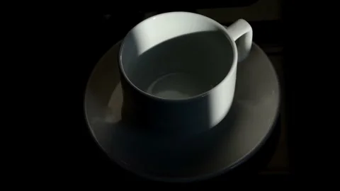 Shadows moving along a tea cup Stock Footage 240766849